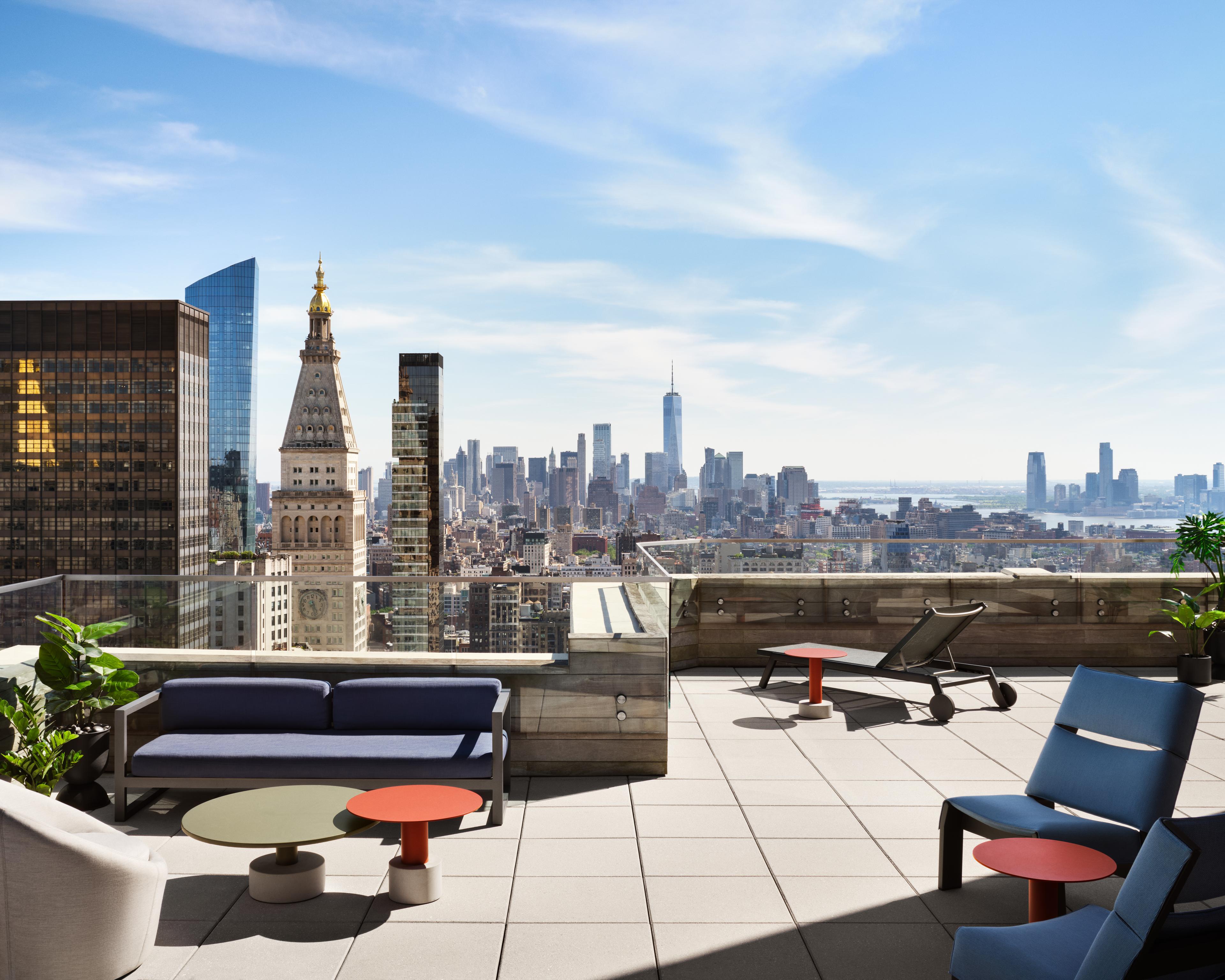 The rooftop desk of Anagram NoMad overlooking the Manhattan skyline.