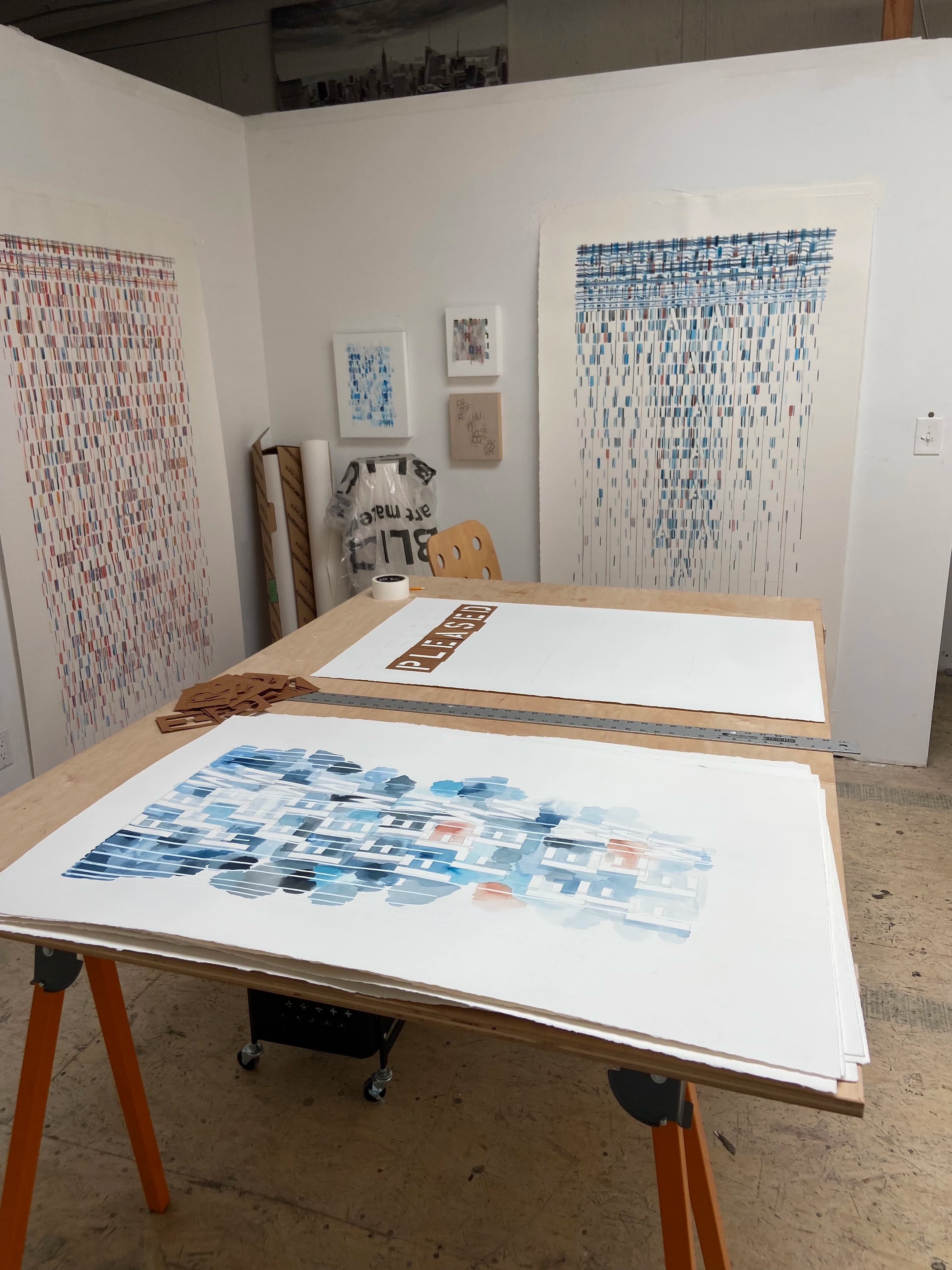 Large, text-based work on paper by artist Gail Tarantino in her studio.