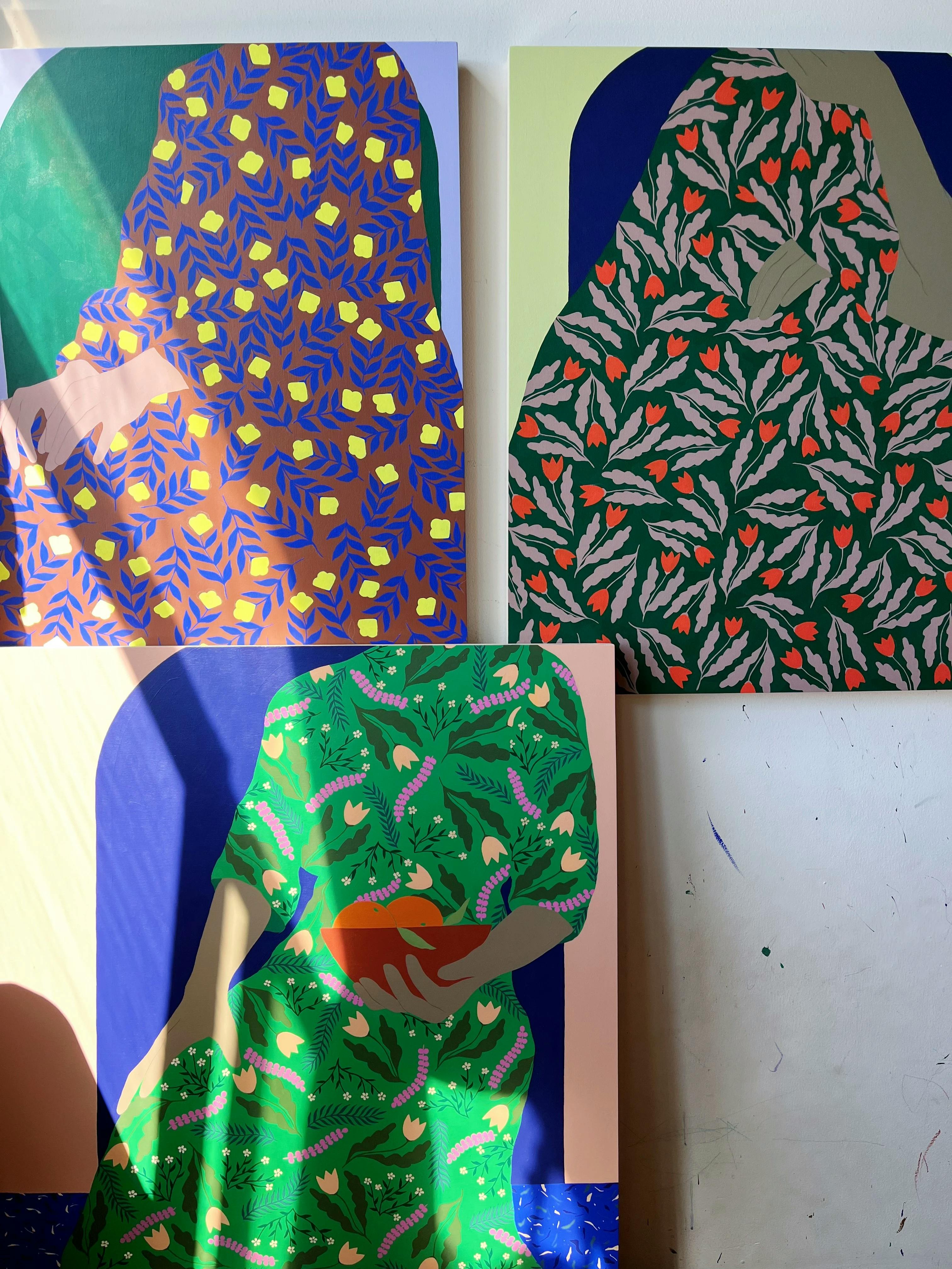 Three paintings on wood panel of headless women in patterned dress by artist Carmen McNall.