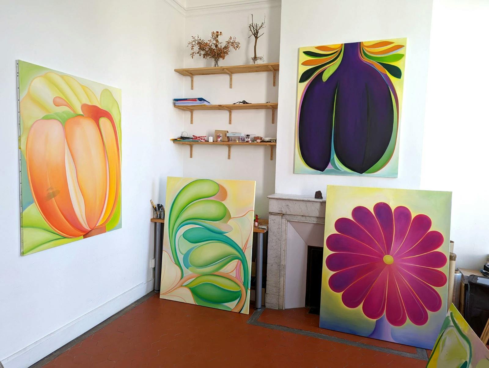 Large, botanical paintings on canvas by artist Roche in their Marseilles studio.
