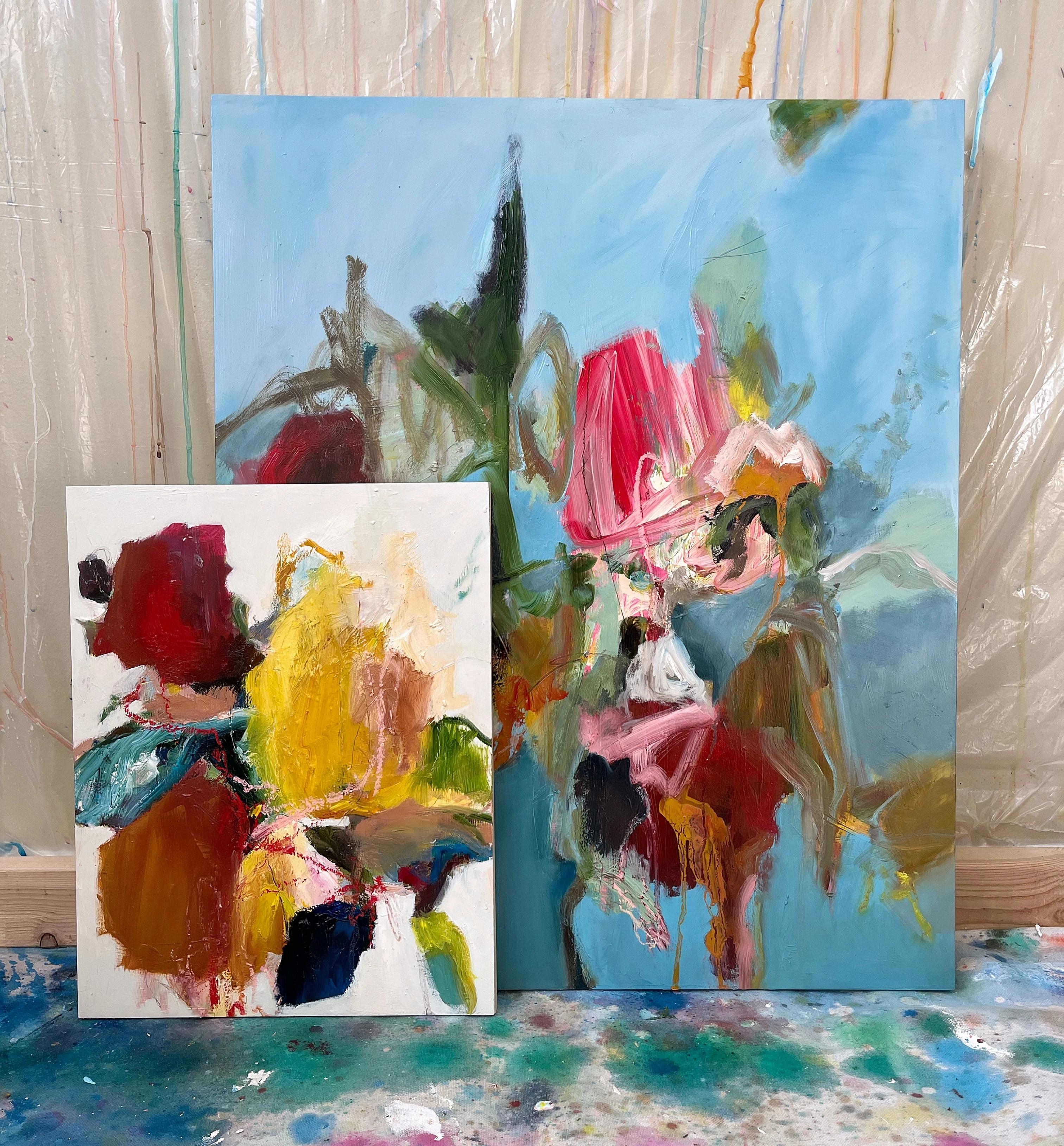 Two abstract, gestural paintings on canvas by artist Elisa Gomez in her studio.