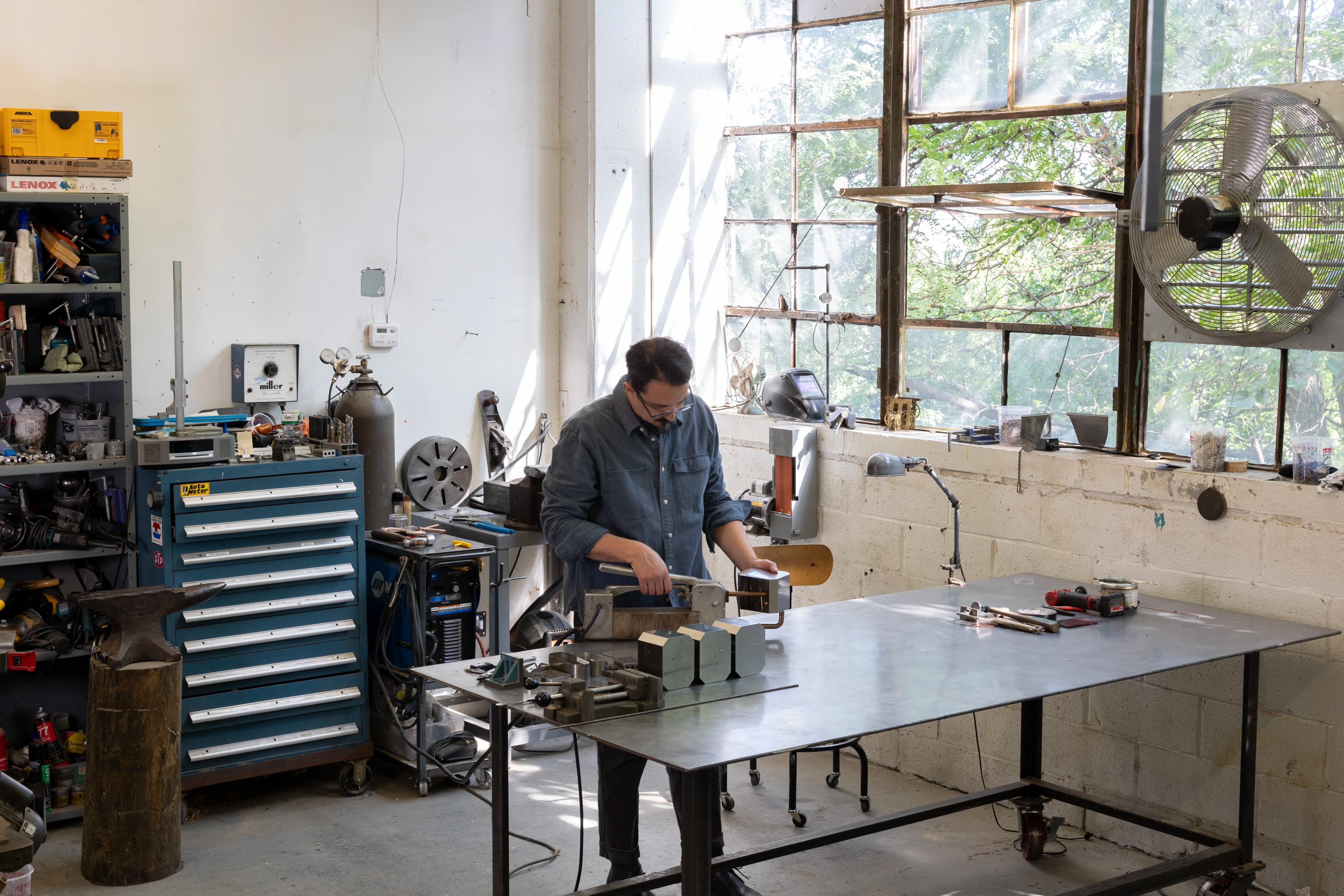 Artist J.C. Fontanive working in his industrial studio.