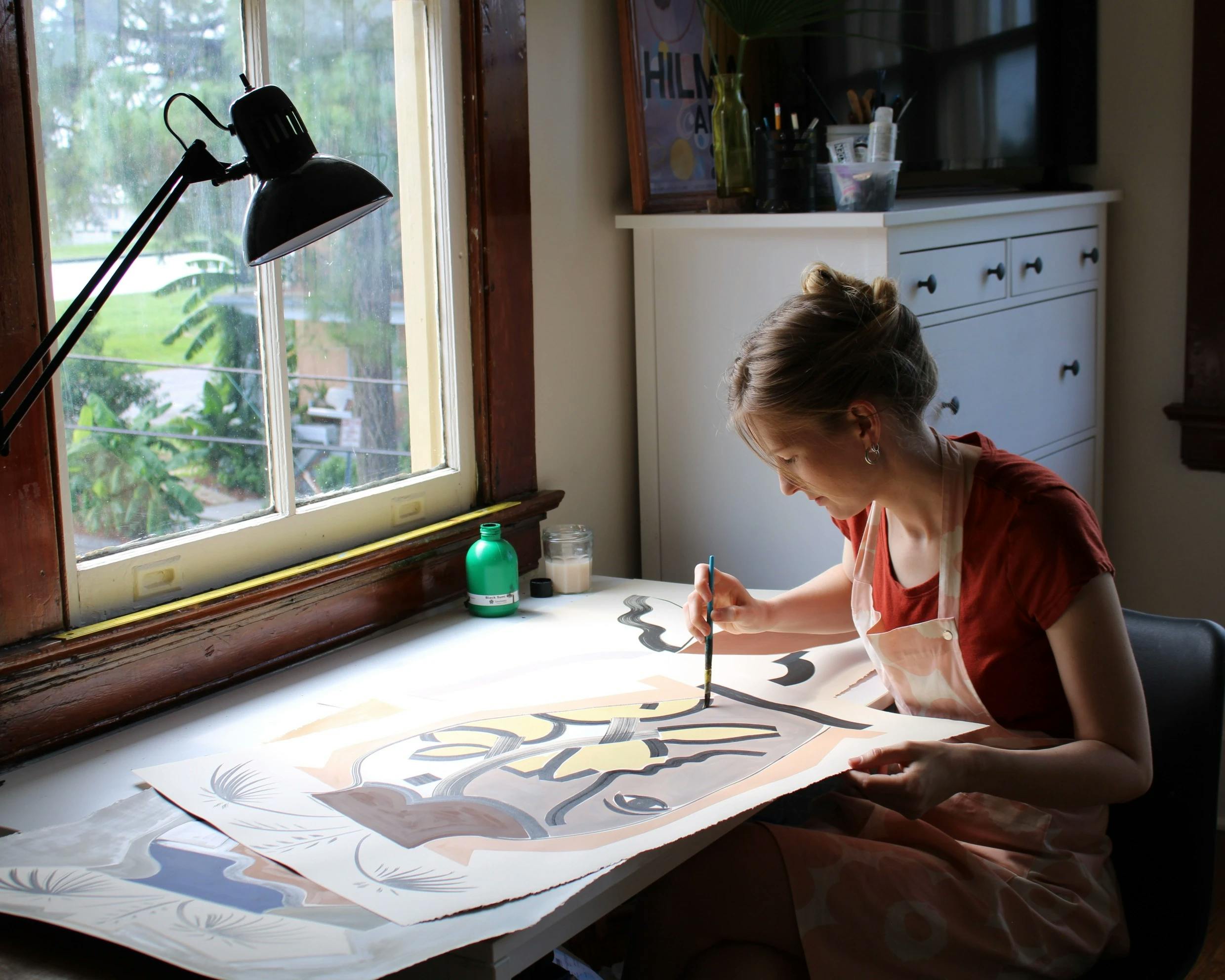 Artist Anna Koeferl working in her studio.