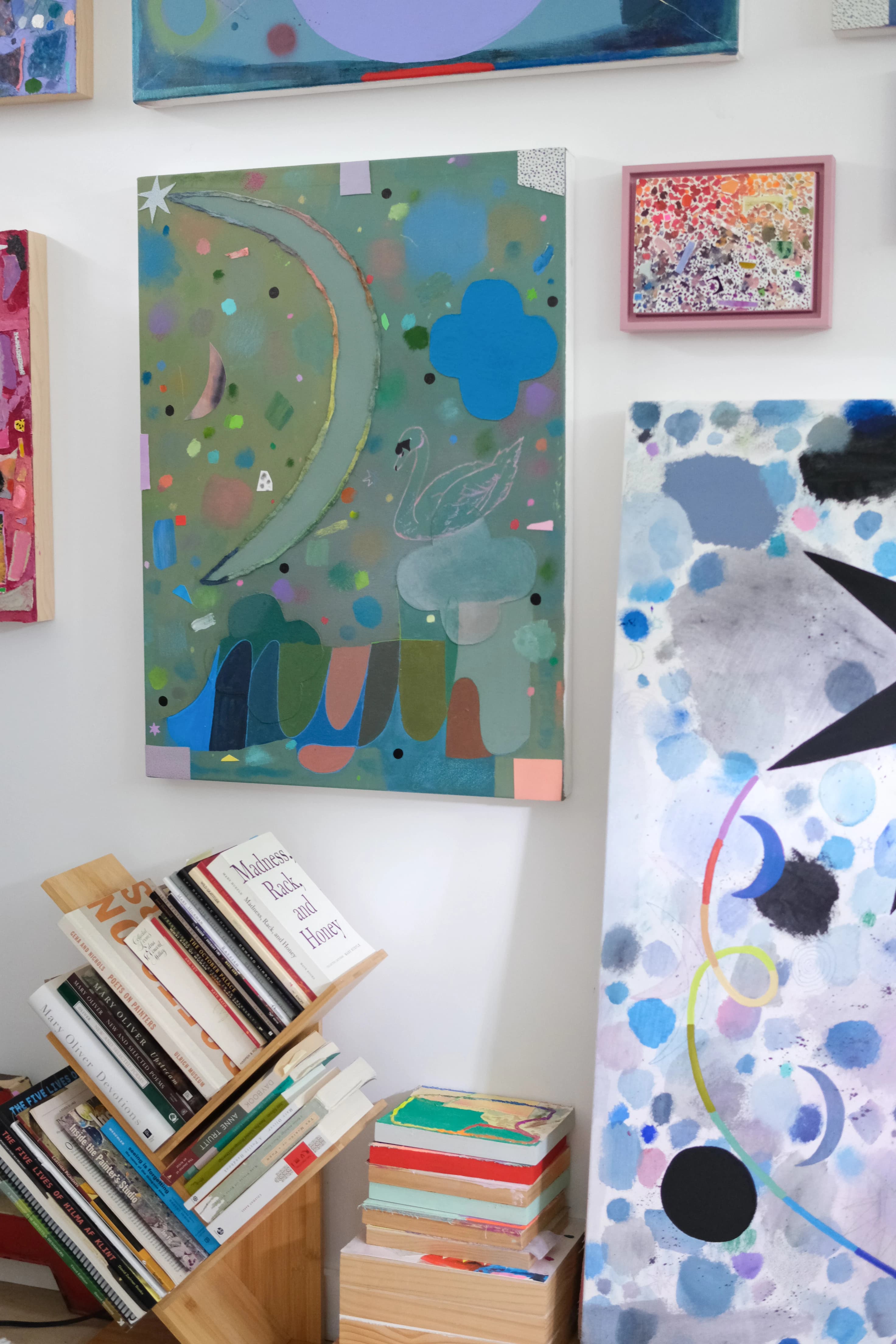 Colorful abstract artwork by artist Ashley Peifer in her studio. 