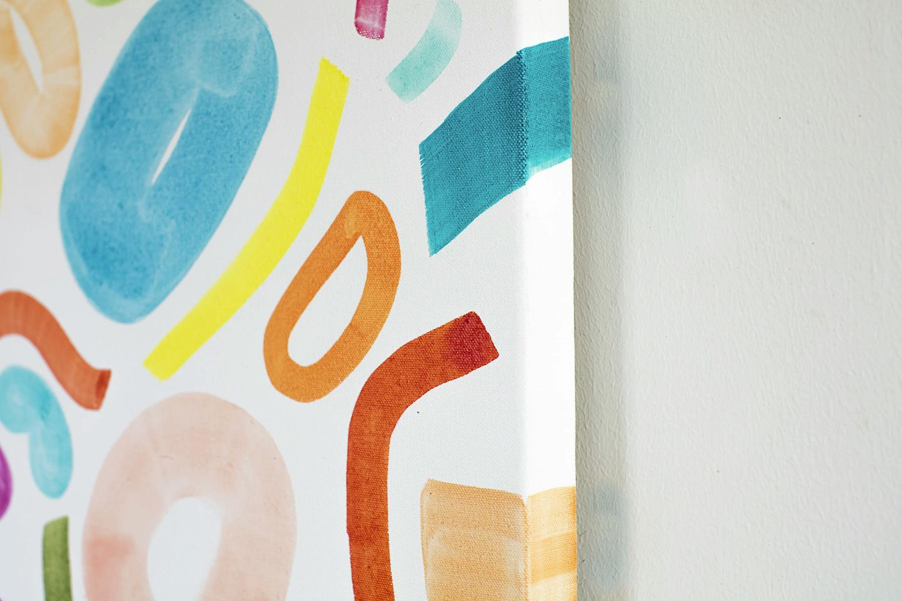 Close-up of a colorful, playful painting by artist Britt Bass.