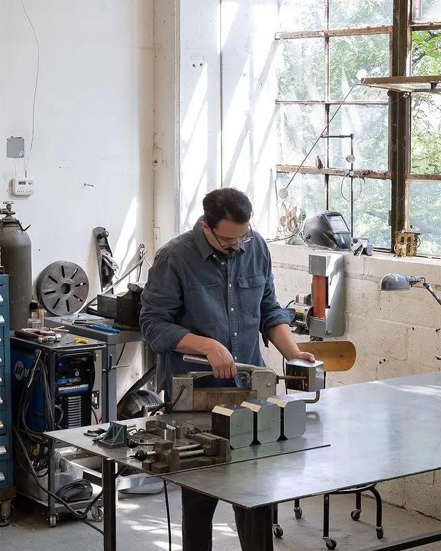 Artist J.C. Fontanive working in his light-filled studio.