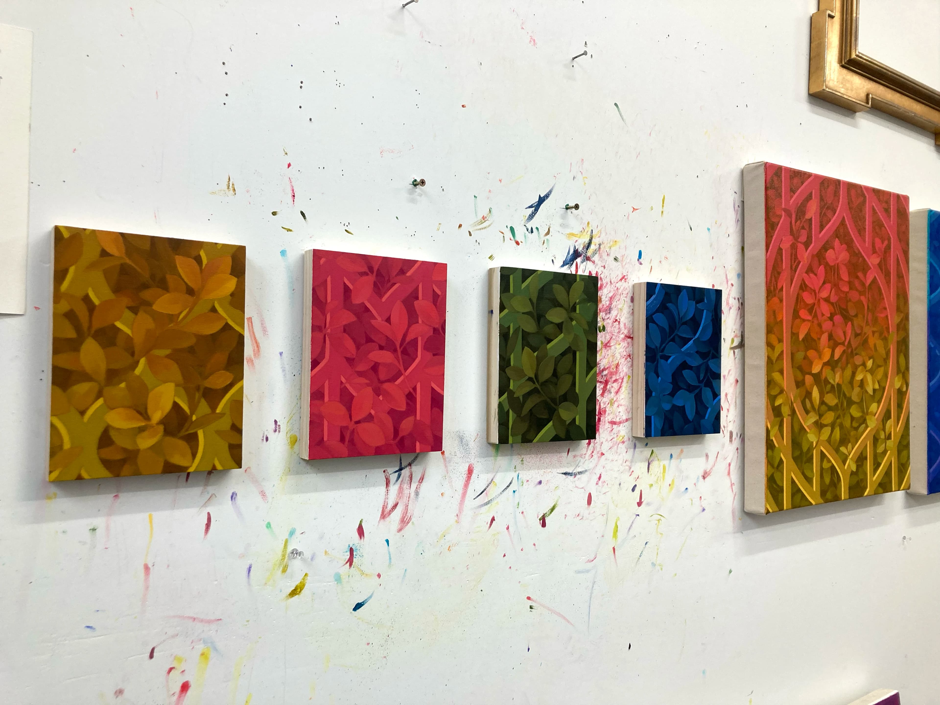 Four small, colorful botanical works on canvas by artist Lucía Rodríguez Pérez.