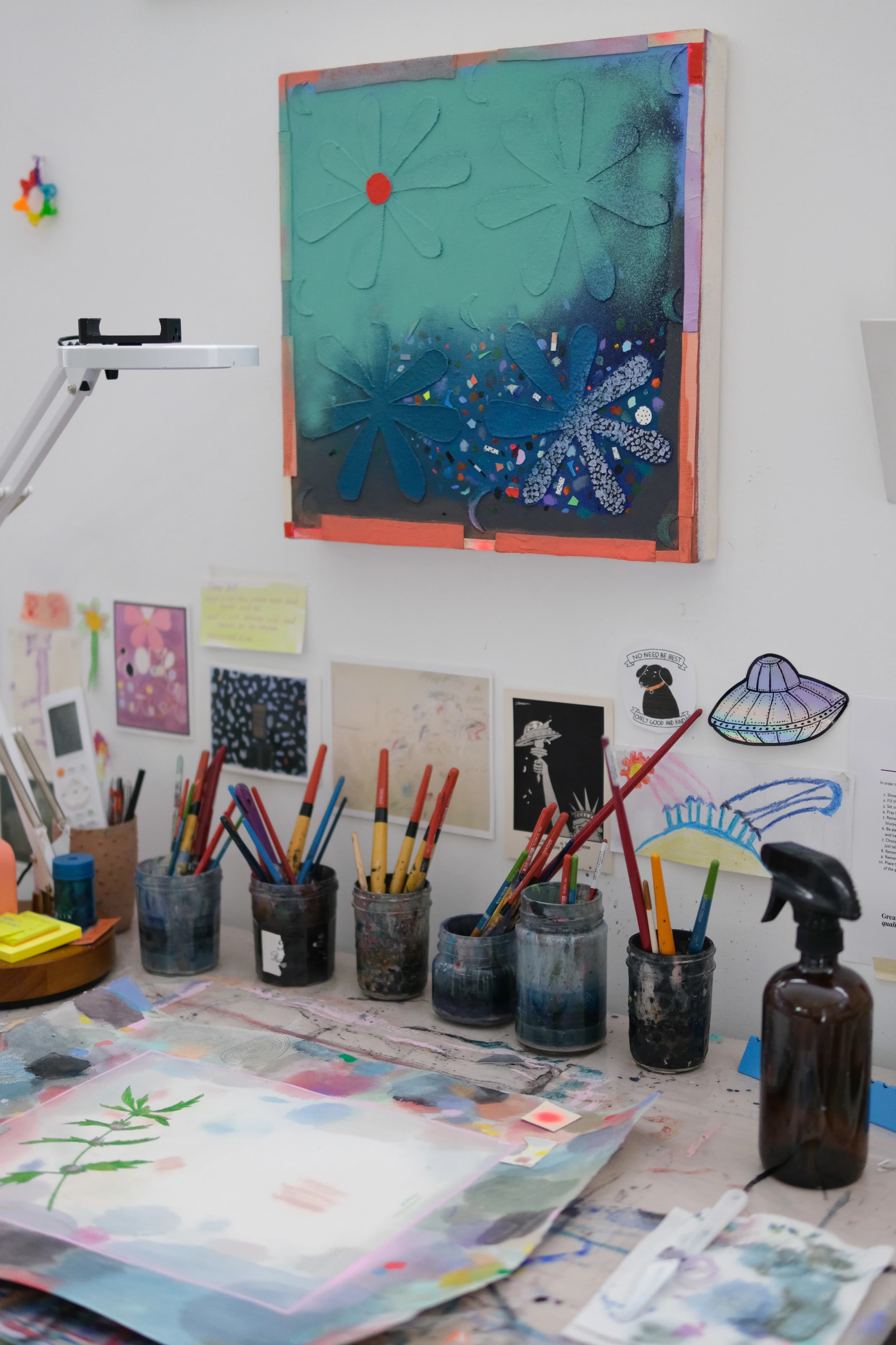 A blue floral abstract work by artist Ashley Peifer in her studio. 