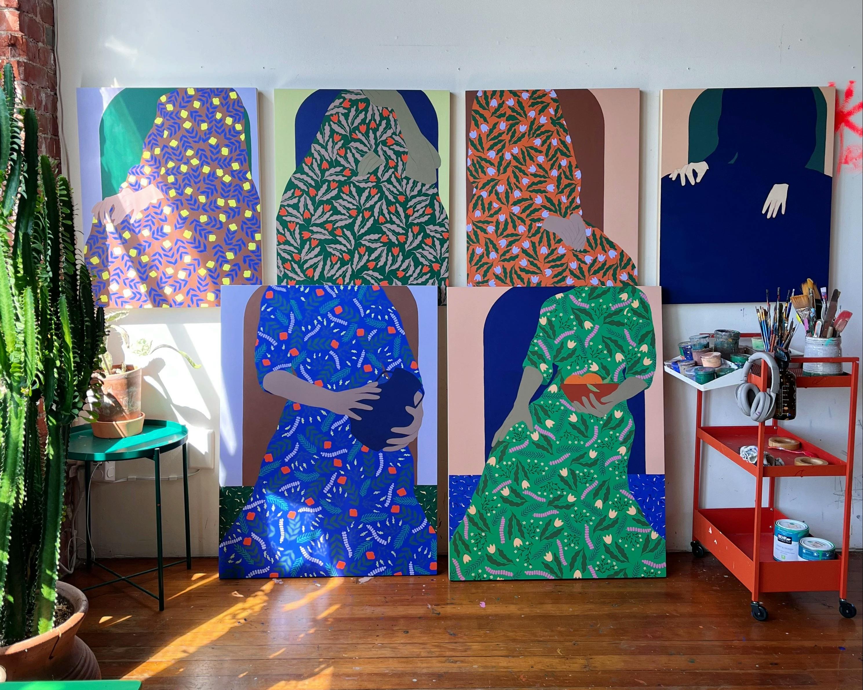 Hand-carved paintings on wood panel of headless women in patterned dress by artist Carmen McNall.