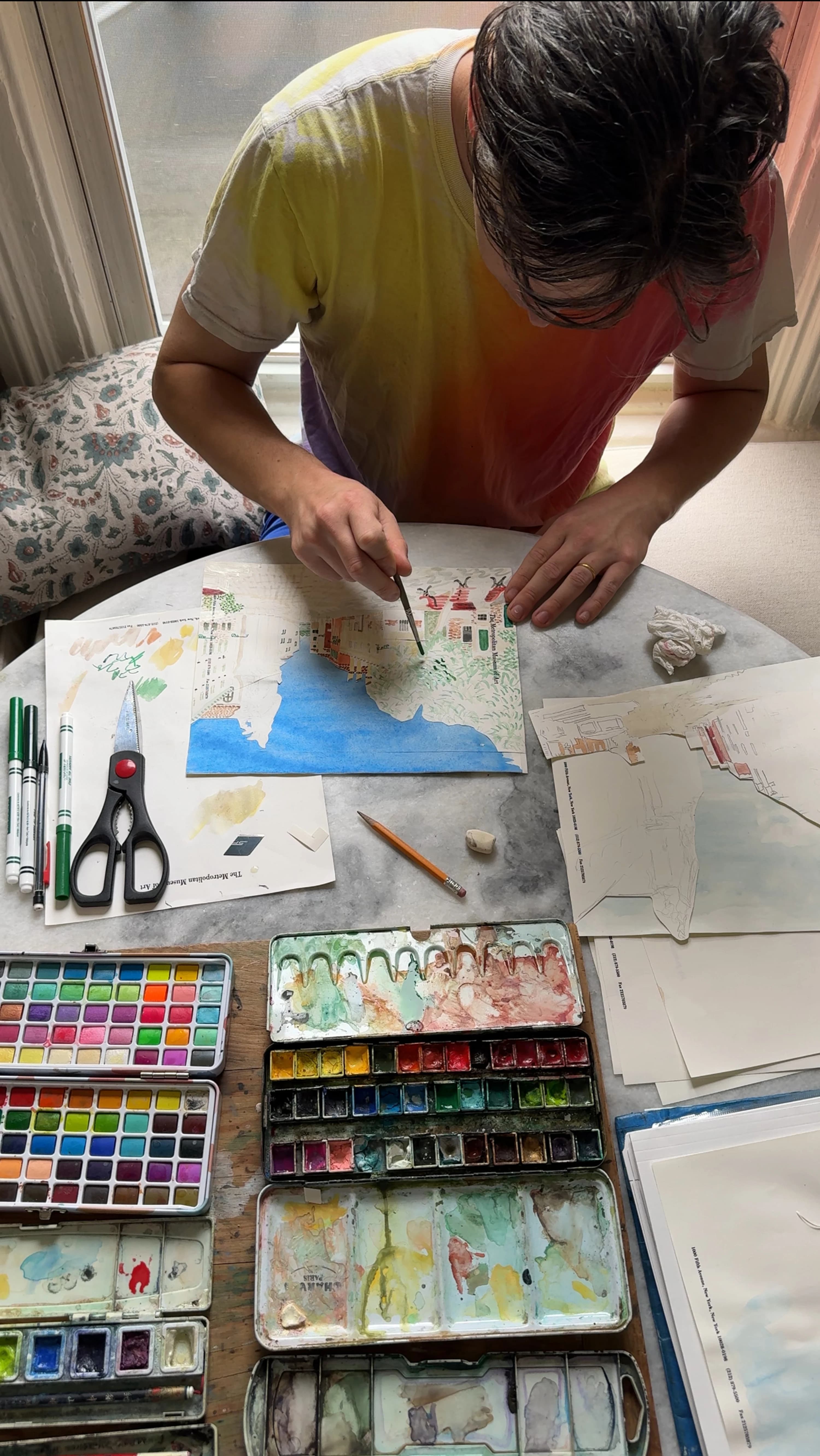 Artist David Rhoads creating works on paper with watercolors in his studio.