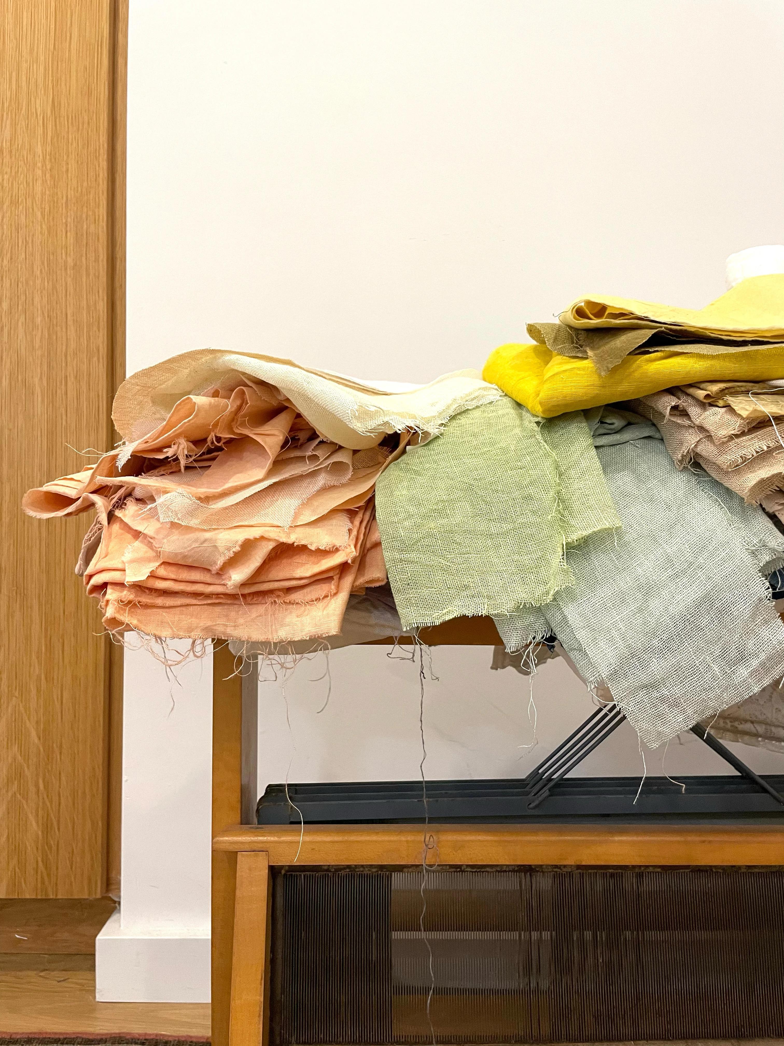 Stacks of naturally-dyed fabric in artist Katrine Hildebrandt-Hussey's studio.